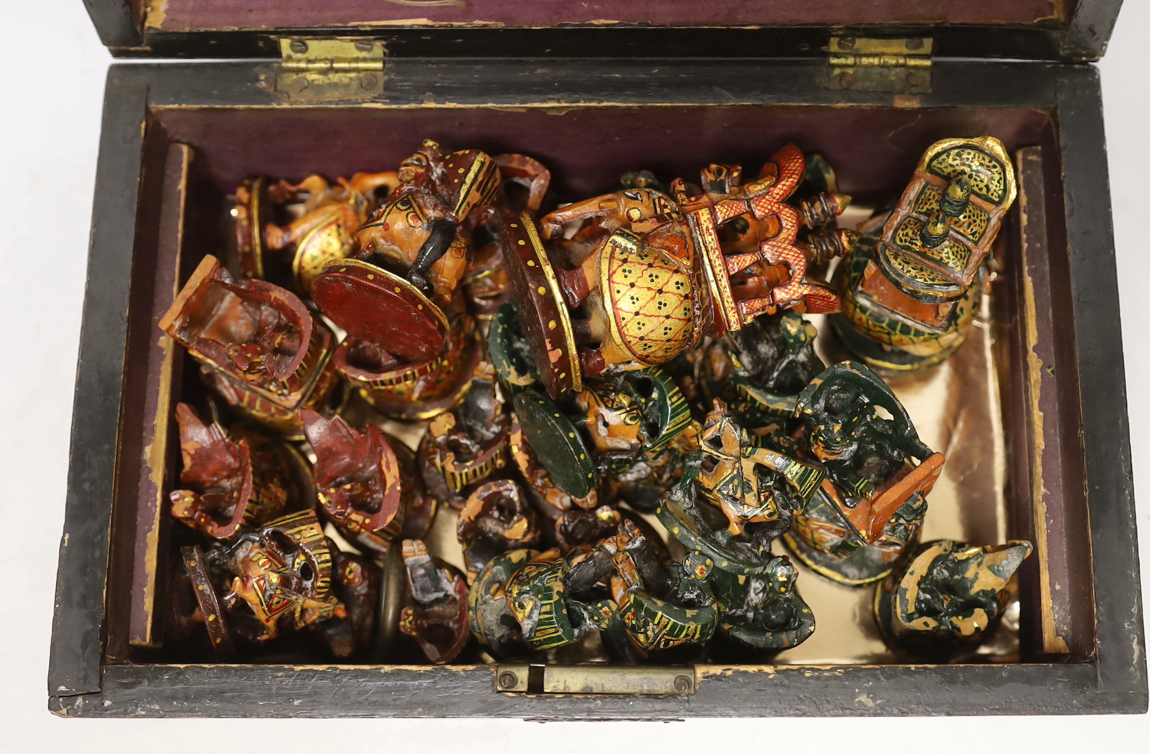 A North Indian carved and painted wood chess set, in an inlaid walnut box